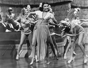 Lena Horne (Center) with Group of Dancers on-set of the Film, "Broadway Rhythm", 1944