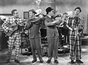 Spike Jones (Left) and his City Slickers, Mickey Katz (Far R), on-set of the Film, "Fireman Save my Child", 1954