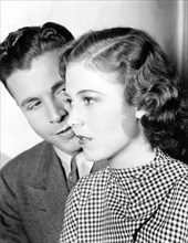 Dick Powell, Josephine Hutchinson, on-set of the Film, "Happiness Ahead", 1934