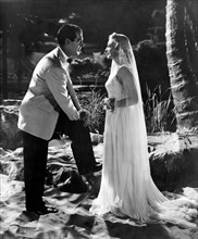 Fred MacMurray, Madeleine Carroll, on-set of the Film, "Honeymoon in Bali", 1939