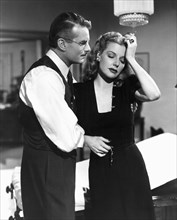 Kent Smith, Ann Sheridan, on-set of the Film, "Nora Prentiss", 1947