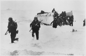 WWII U.S. Soldiers Disembarking Landing Craft on Beach, from the Documentary Film Series, "Why We Fight", Episode "War Comes to America", 1945