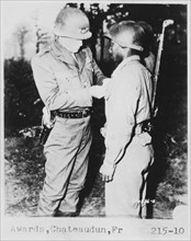 Lt. General George S. Patton Pins Silver Star on Private Ernest A. Jenkin after Liberation of Chateaudun, France, Oct. 13, 1944