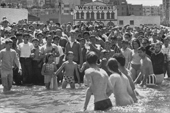 Legalized Nudity Proponents Exiting Water at Aquatic Park While Crowd Watches, San Francisco, California, USA, 1965
