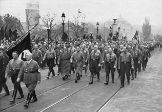 Adolf Hitler, Julius Streicher (foreground, R), and Hermann Goering (L of Hitler) Retrace Steps of 1923 Beer Hall Putsch, Munich, Germany, November 9, 1934