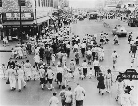 Crowded Street Scene at Intersection of Surf and Stillwell Avenues, Coney Island, New York City, USA, 1944