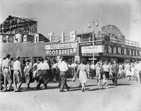 Crowded Boardwalk Scene with Atlantis Ballroom at Right and Ferris Wheel in Background, Coney Island, Brooklyn, New York City, USA, 1947