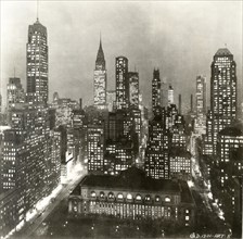Skyline at Night with Public Library in Foregroung and Chrysler Building in Background, New York City, USA, circa 1930's