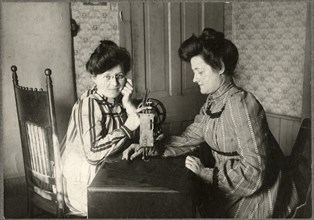 Two Women with Sewing Machine, circa 1900