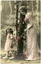 Mother and Daughter in Pink Dresses with Pink Flowers, Hand-Colored French Postcard, circa 1910
