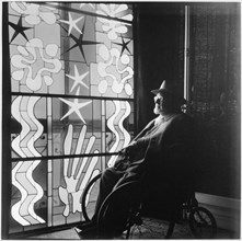 Henri Matisse (1869-1954) in Wheelchair Looking at the work "Nuit de Noel" (Christmas Eve) at his home in the Regina, Nice, France, 1952