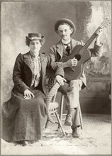 Seated Woman Next To Seated Man with Guitar, Cabinet Card, circa 1913