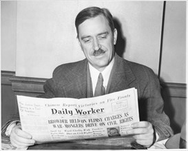 Earl Browder (1891-1973), American Political Activist and Leader of Communist Party USA, Reading Communist Newspaper Article about Himself, circa 1939