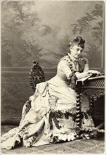 Woman in Bustle Dress Sitting at Desk, circa 1878