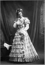 Woman in Long Floral Dress with Hoop Skirt, Portrait, circa 1897