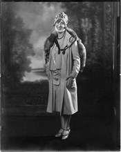 Fashionable Woman in Short Dress and Coat with Mink Fur Stole and Knit Cap, Portrait, circa 1923