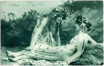 Woman  Kneeling Next to Reclining Woman, both in Sequin Dresses and Floral Hair Wreaths, USA, Postcard, circa 1912