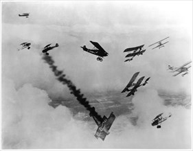 French and German Airplanes During Mid-Air Battle, German Airplane with Smoke Trail Falling from Sky, WWI, circa 1915