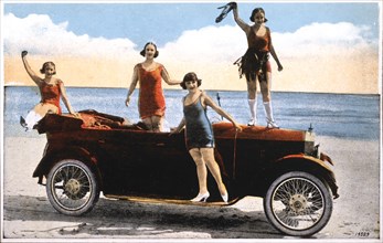 Women Around Convertible Automobile on Beach, California, USA, hand-Colored Photograph, circa 1930