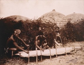 Zulus Scraping a Stretched Hide, Africa, circa 1890