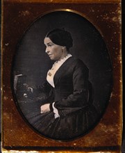 Woman Sitting in Chair Holding Book, Profile, Daguerreotype, circa 1850's