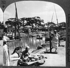 Vendor of Bread and Pastries Beside Mahmudiyeh Canal, Alexandria, Egypt, Single Image of Stereo Card, circa 1900
