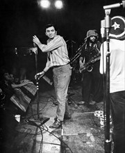 Bill Graham Setting up Microphone, on-set of the Documentary Film, "Fillmore", 1972