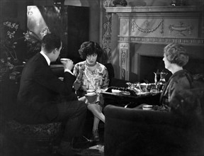 Eugene O'Brien, Gloria Swanson, Helen Dunbar, on-set of the Silent Film, "Fine Manners", 1926