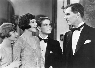 Patricia Deering, Claudette Colbert, Tom Brown, Walter Huston, on-set of the Film, "The Lady Lies", 1929