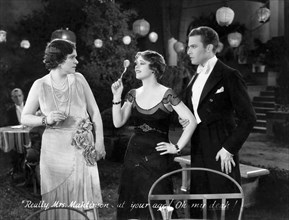 Clara Bow (center), Stanley Smith, on-set of the Film, "Love Among the Millionaires", 1930