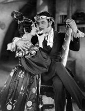 Renee Adoree, John Gilbert, on-set of the silent film, "The Boheme", 1926