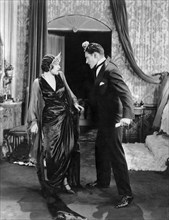 Aileen Pringle, Ronald Colman, on-set of the Silent Film "A Thief in Paradise", 1925