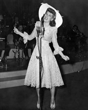 Dinah Shore, Singing on-set of the Film "Thank Your Lucky Stars", 1943
