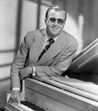 George Shearing, Portrait in Sunglasses Leaning on Piano, circa 1959