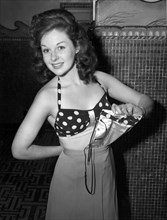 Susan Hayward, Portrait Wearing Bathing Suit Top and Skirt, 1943