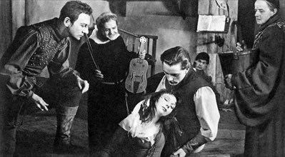 John Gielgud, Pamela Brown, Richard Burton, (kneeling), on-set of the Broadway Play "The Lady's Not for Burning", Royale Theater, New York, 1950