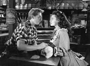 Lloyd Bridges, Rhonda Fleming, on-set of the Film "Abilene Town", 1946