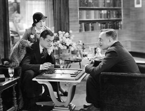 Billie Dove, Robert Montgomery, Douglas Dumbrille, on-set of the Film "Blondie of the Follies", 1932