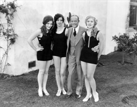 Director Harry Beaumont with Chorus Girls, on-set of the Film "The Broadway Melody", 1929