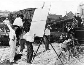 Director Clarence Brown, (left), John Gilbert, (in carriage), on-set of the Silent Film "Flesh and the Devil", 1926
