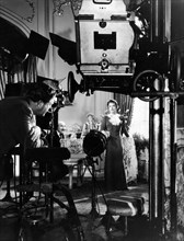Director Robert Z. Leonard, Luise Rainer, on-set of the Film "The Great Ziegfeld", 1936