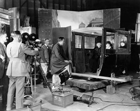 Cinematographer Chester A. Lyons, (camera), Director King Vidor, (at car), Edith Yorke, Laurette Taylor, Hedda Hopper, on-set of the Silent Film "Happiness", 1924