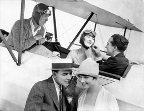 Dorothy Mackaill, Jack Mulhall, (right, in plane), William Collier, Jr., Louise Brooks, on-set of the Silent Film "Just Another Blonde", 1926