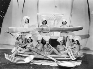 Chorus Girls with Large Spoon, Fork & Knife, on-set of the Film "Merry-Go-Round of 1938", 1937
