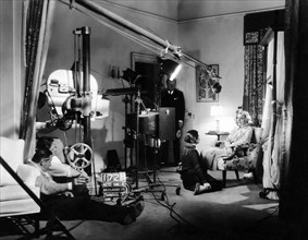 Director Richard Boleslawski, Cinematographer William Daniels, Soo Yong, Greta Garbo, on-set, of the Film "The Painted Veil", 1934