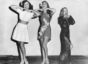 Paulette Goddard, Dorothy Lamour, Veronica Lake, on-set of the Film "Star Spangled Rhythm", 1942