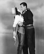 Ella Raines, John Wayne, on-set of the Film "Tall in the Saddle", 1944