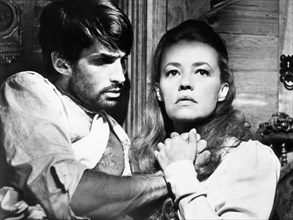 George Hamilton, Jeanne Moreau, on-set of the Film "Viva Maria", 1965