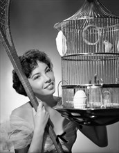Actress Leslie Caron, Portrait with Birdcage, 1951