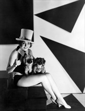 Actress Nancy Carroll, Portrait with Pekingese Puppies, 1929